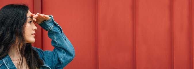 urban young girl posing at wall with copy space