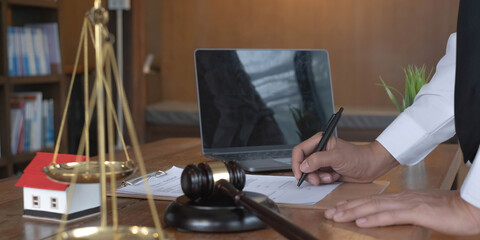 Close up lawyer businessman working or reading lawbook in office workplace for consultant lawyer concept.