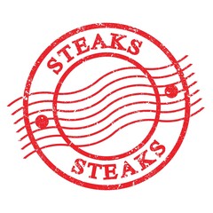 STEAKS, text written on red  postal stamp.