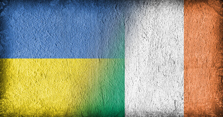 Ukrainian and Irish flag on concrete