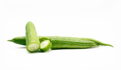 Snake gourd slices over white background