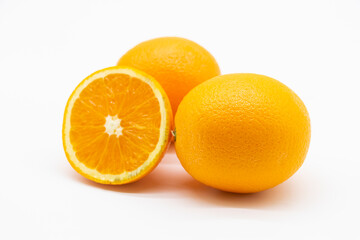 whole and slices orange fruit isolated on white background