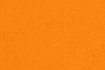 Saturated pastel orange colored low contrast Concrete textured background. Empty colourful wall texture with copy space for text overlay and mockups. 2023, 2024 color trend