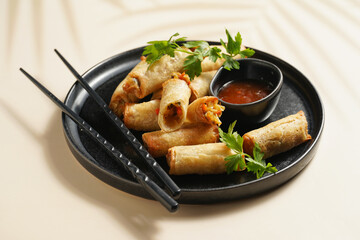 Traditional southeast asian starter dish spring or summer rolls - deep fried dim sum dumplings...