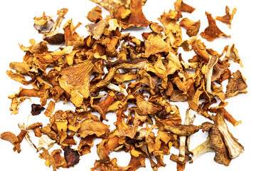 Dried chanterelles, dehydrated mushrooms on white.