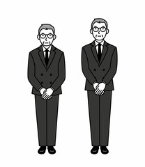 お辞儀をする喪服のシニア男性