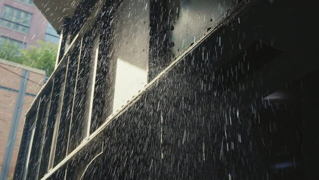 Water dripping from a railway underpass in New York, close up and slow motion.