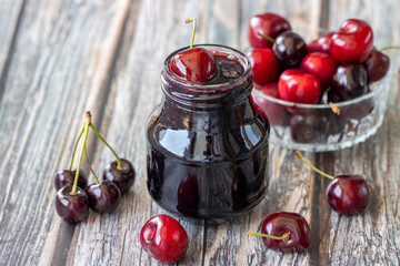 Jars with fresh homemade cherry jam