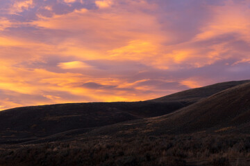 Fototapeta na wymiar Orange cloud sunset in Lamar Valley in Yellowstone National Park