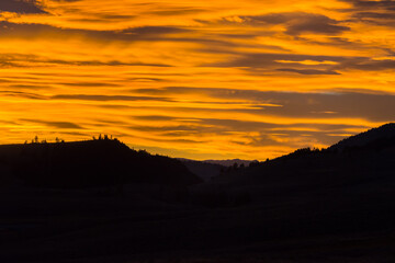 Orange cloud sunset in Lamar Valley in Yellowstone National Park