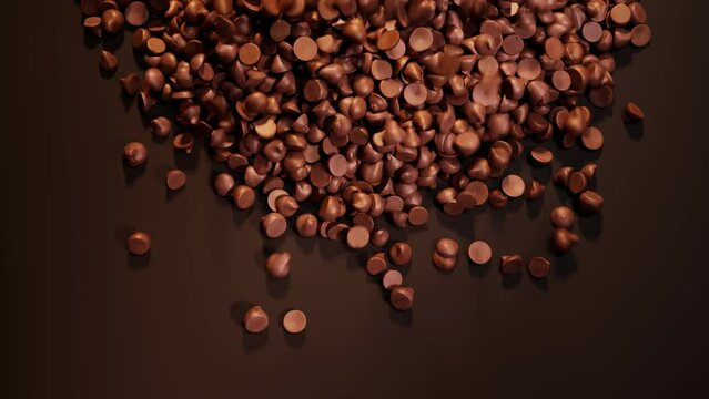 The pile of dark chocolate chips the brown background. Sweet temptation. Candies
