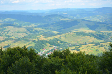 Fototapeta premium Summer landscape bird's-eye view from the top of the mountain. Travelling to the mountains , trip to the Carpathian mountains concept 