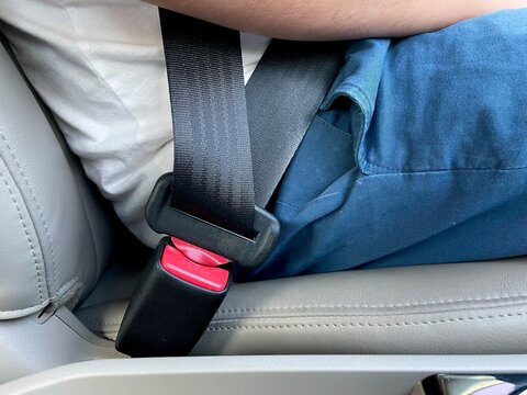 man wearing car seatbelt