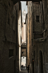 Alley leading to the Piazza del Campo and Torre del Mangia, Siena, Italy