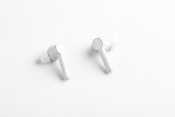 Technology concept : wireless ear bud or headphone on white background.