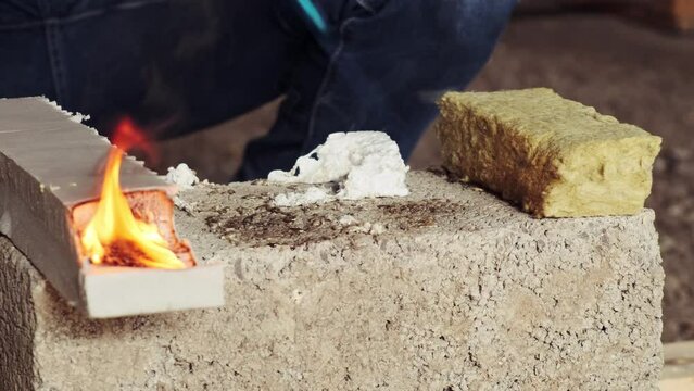 Checking for combustibility of materials for insulating the walls of the house. Burner ignition Extruded polystyrene foam, polystyrene foam, mineral wool. Slow motion
