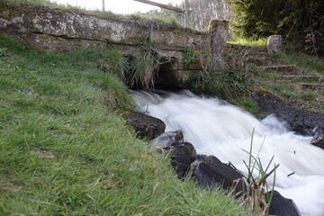 Water cascade with strong current at small lake Schwarzweiher in Palatinate landscape (long exposure), concept: refreshment, outdoor, power (horizontal), Enkenbach-Alsenborn, RLP, Germany
