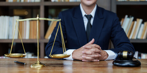 Close up lawyer businessman working or reading lawbook in office workplace for consultant lawyer concept.
