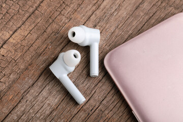 Wireless ear buds or headphone with smartphone. technology concept.