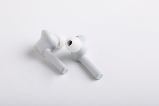 Technology Concept : Wireless Ear Bud Or Headphone On White Background.