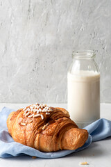 Breakfast with croissant nad milk. Copy space.