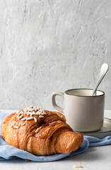 Breakfast with coffee and croissant.