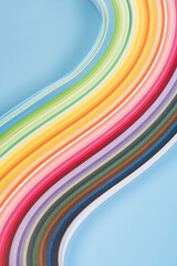 rainbow colors paper composition.Colorful curve striped on blue background.