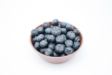 Blueberries in a bowl isolated on white background