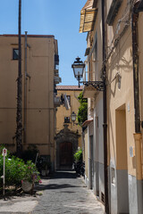 Fototapeta na wymiar Old narrow stone streets of Sorrento in southern Italy. The historical center of the city.
