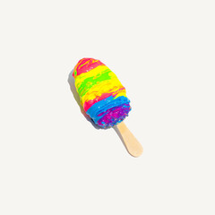 Colorful ice cream covered with acrylic paint on white background. Creative summer composition. Abstract food idea.