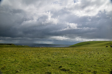 Aran Islands irish landscape with houses, boats and a cemetery