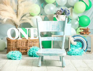 sliver, blue and white decoration for a 1st birthday cake smash studio photo shoot with balloons,...
