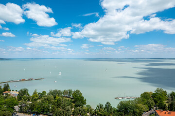 View of Balaton lake on a sunny day with blue sky and clouds, view from Tihany village, Hungary
