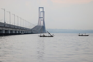 The Suramadu Bridge at Twilight with colorful lighting in Surabaya,Indonesia.Is the longest Bridge in Indonesia.