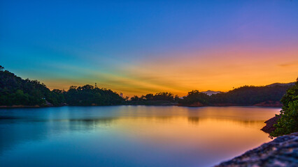 Naklejka na ściany i meble Fantastic colorful sunset over the lake