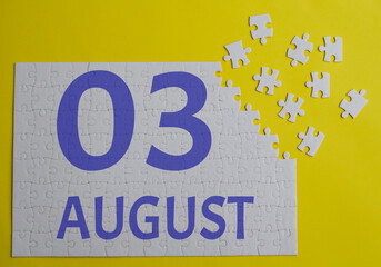 3 august calendar date on a white puzzle with separate details. Puzzle on a yellow background with a blue inscription