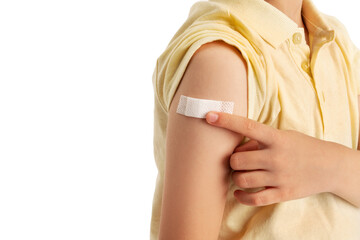 Little boy with plaster on his arm, recieved vaccination.