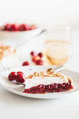 Plate with tasty cherry pie on white background. Top view. Front view