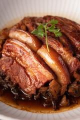 Braised Pork Belly with Preserved Mustard Green on with rice red background