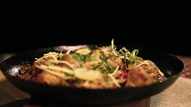 Indian Chicken Karahi Handi Food With Corindar Sprinkle Male Hand Black Background