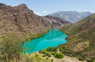 Beautiful mountain landscape on sunny day. Turquoise water of Naryn river in the mountains not far from Jalal-Bad. Kyrgyzstan