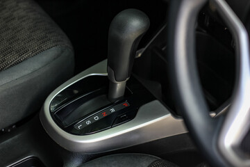 automatic transmission shift selector in the car interior. Closeup a manual shift of modern car...
