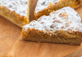 pieces of pie in wooden desk on white background