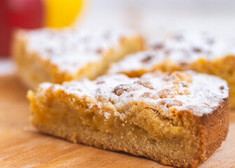 apple pie on wooden desk on white table