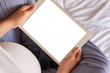Pregnancy digital tablet mockup. Pregnant woman holding smart tablet. Mobile pregnancy online maternity application mock up. Concept of pregnancy, maternity, expectation for baby birth.