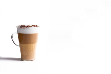 Milk coffee or latte macchiato glass, on white background. Italian coffee with milk and layers. Gourmet coffee.