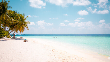 Obraz na płótnie Canvas Vacation summer holidays background wallpaper - sunny tropical Caribbean paradise beach with white sand in Seychelles Praslin island Thailand style with palms