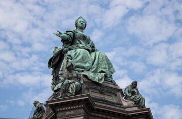 Fototapeta na wymiar Empress Maria Theresa (ruler of the Habsburg dominions) monument in the old town of Vienna, the capital of Austria, Central Europe. Ancient bronze statue closeup. 