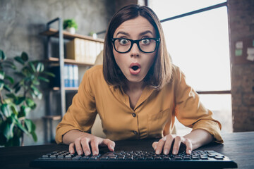 Portrait of attractive stunned girl expert typing staring reading sudden finance news development...