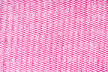 Close-up texture of natural pink coarse weave fabric or cloth. Fabric texture of natural cotton or linen textile material. Blue canvas background. Decorative fabric for upholstery, furniture, walls